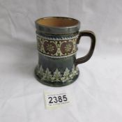 An early Royal Doulton cup with marks including hd and nn.