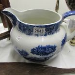 A large blue and white jug.