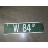 A W 84 ST 'West 84 Street' double sided road sign