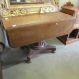 A Victorian mahogany Pembroke table on centre pedestal.