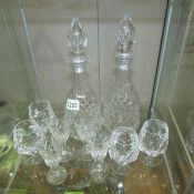 2 cut glass decanters and 8 glasses.