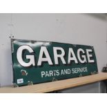 An enamel sign 'Garage Parts and Service'