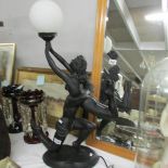 A modern figural table lamp with shade.