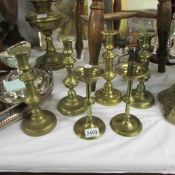 3 pairs of Victorian brass candlesticks.