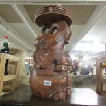 A 20th century wooden elephant stool.