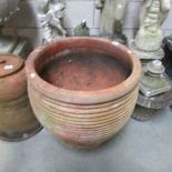 A large terracotta planter.