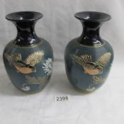A pair of Lovatts Langley ware vases featuring flying bird design.