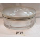 A large oval lidded Lalique box (small crack to lid).