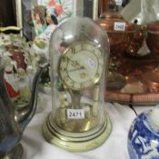 A German 'Kundo' skeleton clock under glass dome.