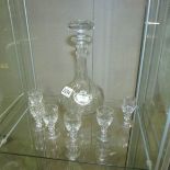 A cut glass decanter and 6 glasses.