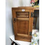 A 1930's oak bedside cabinet