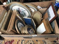 A box of pictures & picture frames etc.