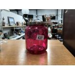 A cranberry glass biscuit barrel