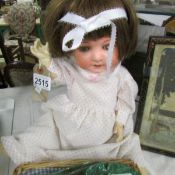 A German porcelain headed doll.