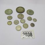 A collection of British coins including 1935 crown, 1920 & 1921 half crowns,
