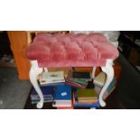 A pink velour dressing table stool