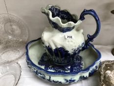 A blue and white jug and bowl