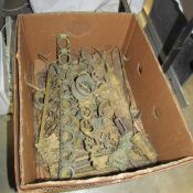 A box of assorted brass fittings.
