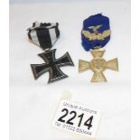 A German 25 year long service cross and an iron cross first class 1914 version (no document of