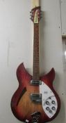 A Rickenbacker semi acoustic guitar with solid case, untested.