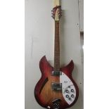 A Rickenbacker semi acoustic guitar with solid case, untested.