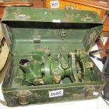 A metal military box marked Case No.7, Director MkIII, OS2182 A containing a military level/sight.