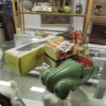 A Schuco 4001 tinplate clockwork car, A Dinky 825 Dukw and a Corgi radar van.