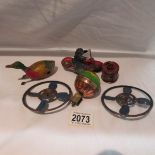 4 tinplate toys including motorcycle and Llehman hot air balloon spinning top.