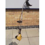 A Ryobi petrol strimmer & a Partner T240 petrol strimmer