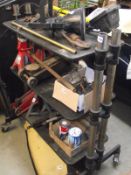 A set of adjustable workshop shelves on wheels