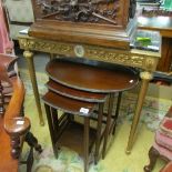 A gilded marble topped console table.