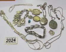 A mixed lot of white metal jewellery including 2 lockets, bracelets, chains etc (some silver).