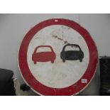 A no overtaking road sign