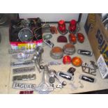 A quantity of car lights and badges,