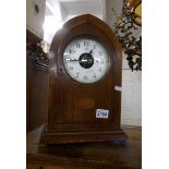 A Bulle battery operated mantel clock in mahogany inlaid case.