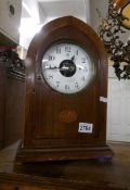 A Bulle battery operated mantel clock in mahogany inlaid case.