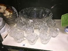 A glass punch bowl with 12 cups (only 7 clips)