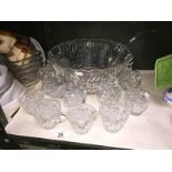 A glass punch bowl with 12 cups (only 7 clips)