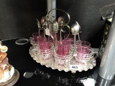 A tea stand with mounted glass teacups & 6 small cranberry glass tumblers