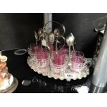 A tea stand with mounted glass teacups & 6 small cranberry glass tumblers
