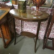An Edwardian oval inlaid occasional table.