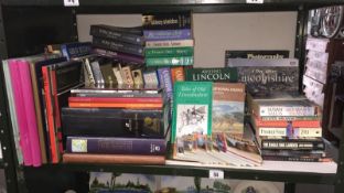 A quantity of various hardback and paperback books including Travel