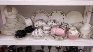 A shelf of assorted tea/dinner sets including Colcough
