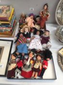 A quantity of costume dolls