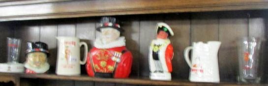 A collection of Beefeater London gin advertising items including jugs, figures etc.