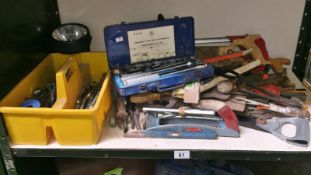 A shelf of tools, spanners, socket set etc.