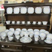 Approximately 54 pieces of Art Deco tea ware in blue with silver coloured rims.