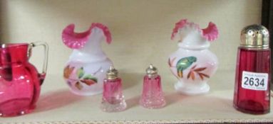 A pair of hand painted glass vases and 4 items of cranberry glass.