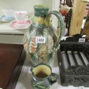 A Denby 'Studio' jug signed 'Glyn College' and a glazed terracotta studio pottery jug.