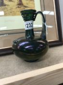 An ingredient art glass jug with pontil mark